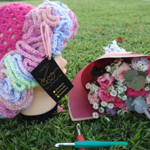 Hat with Pastel Ruffles & Floral Arrangement