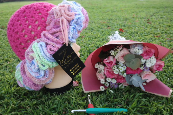 Hat with Pastel Ruffles & Floral Arrangement